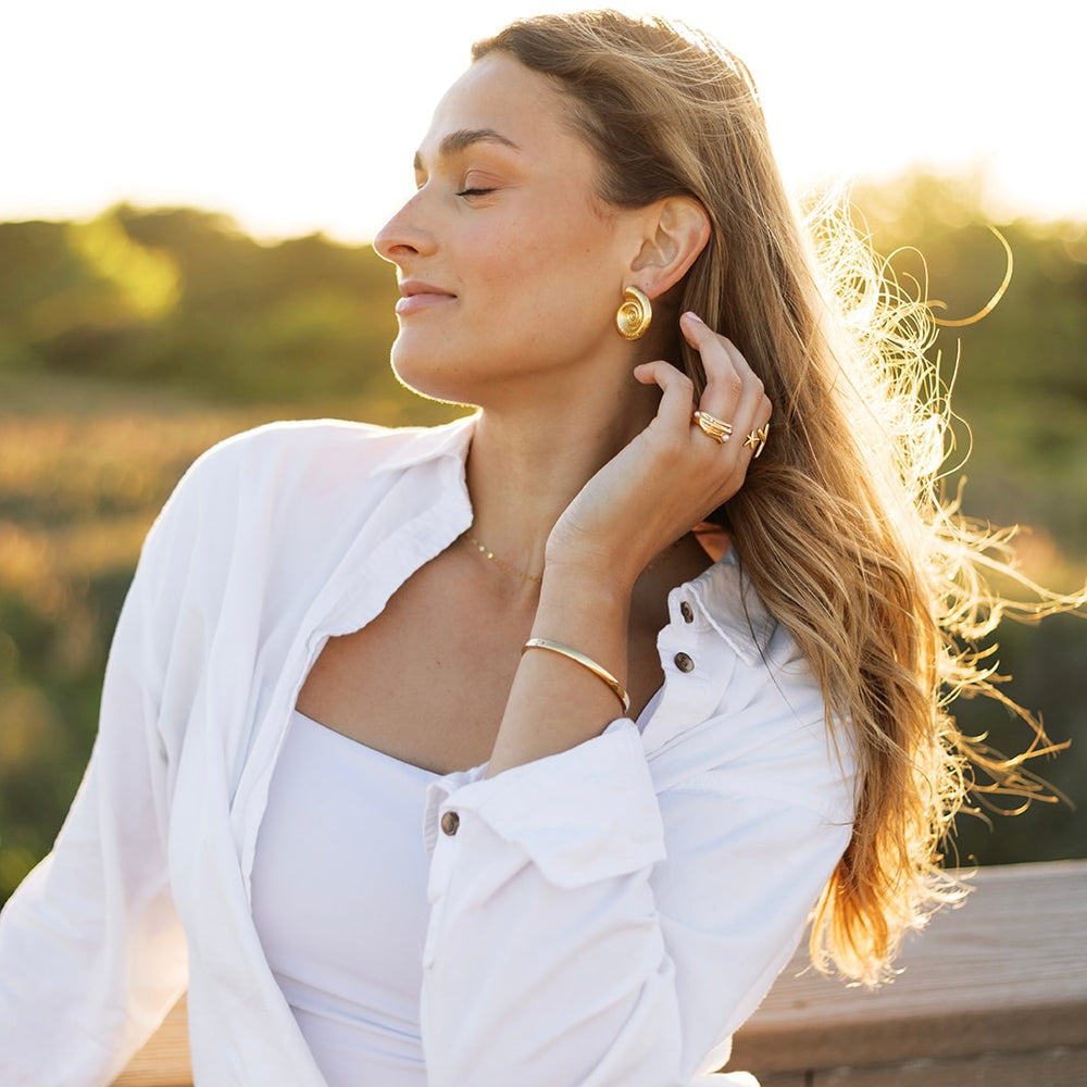 
                      
                        Francesca Spiral Conch Shell Earrings
                      
                    