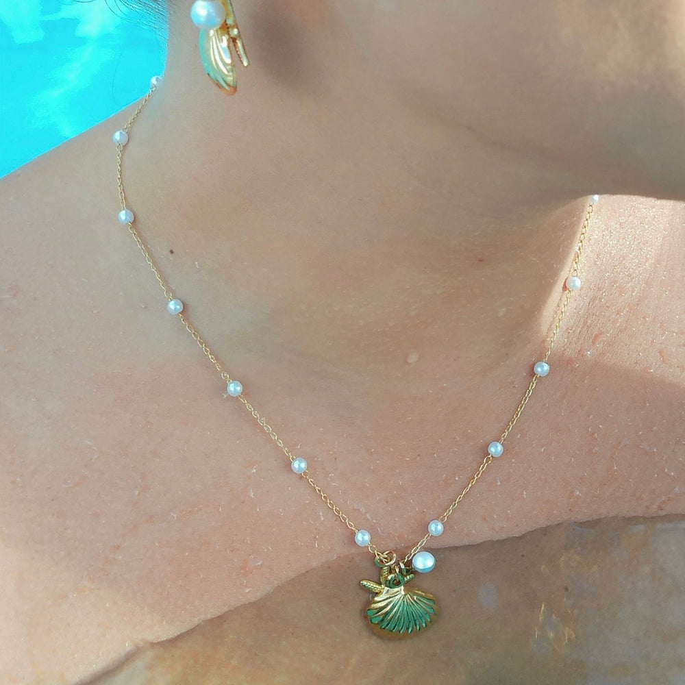 
                      
                        Azure Starfish & Pearl Shell Necklace
                      
                    